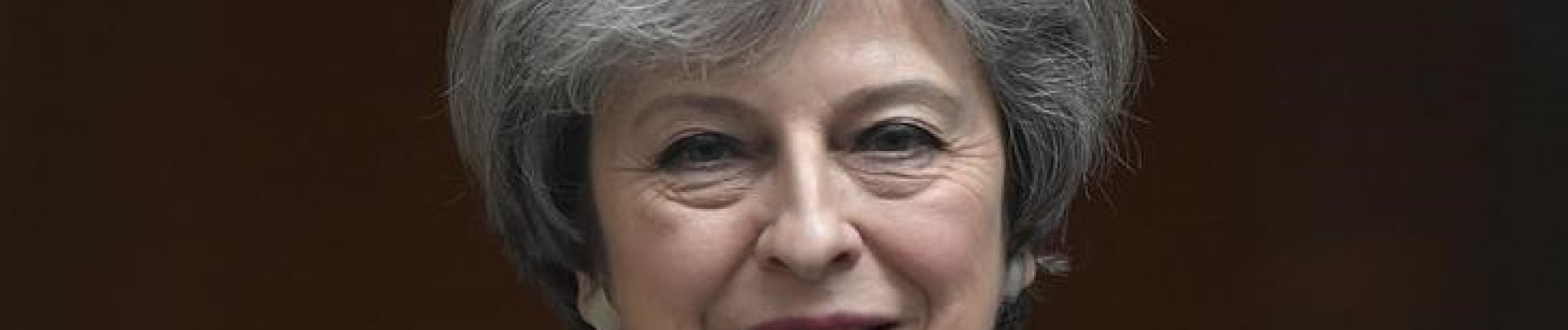 Pas au gouvernement de dire aux femmes comment s'habiller, dit May